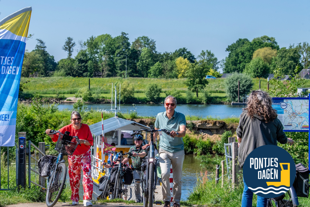Smiling people on bicycles at a sunny riverside event, with a blue-yellow banner on the left and a circular event logo at the bottom right.